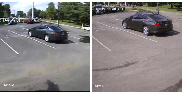 view of car in parking lot shown on security camera monitor