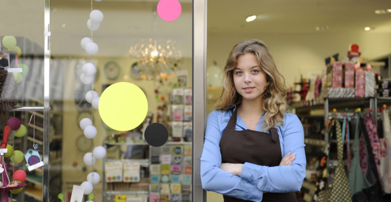 small female business owner in front of gift store
