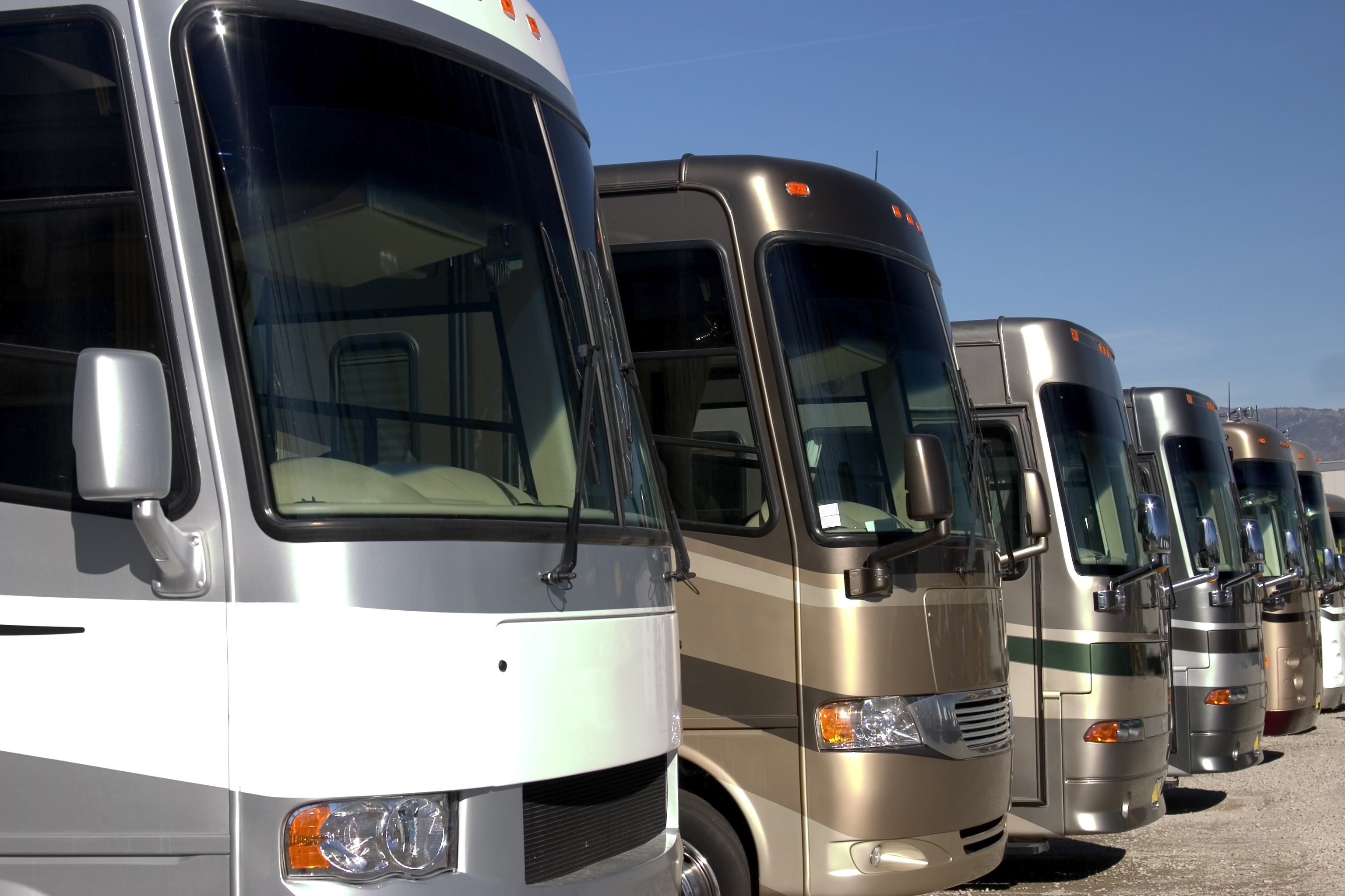 RV vehicles lined up in a row in parking lot in st louis missouri