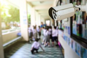 video surveillance security camera in school hallway