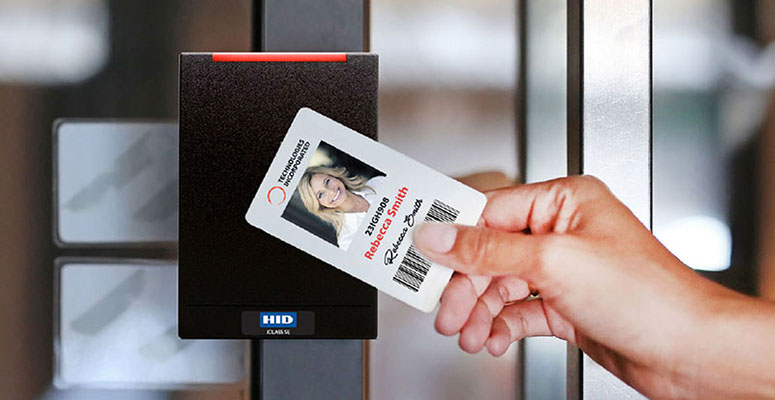 Employee Using Swipe Card On Business Access Control Card Reader Security Systems Installed By Pass Security