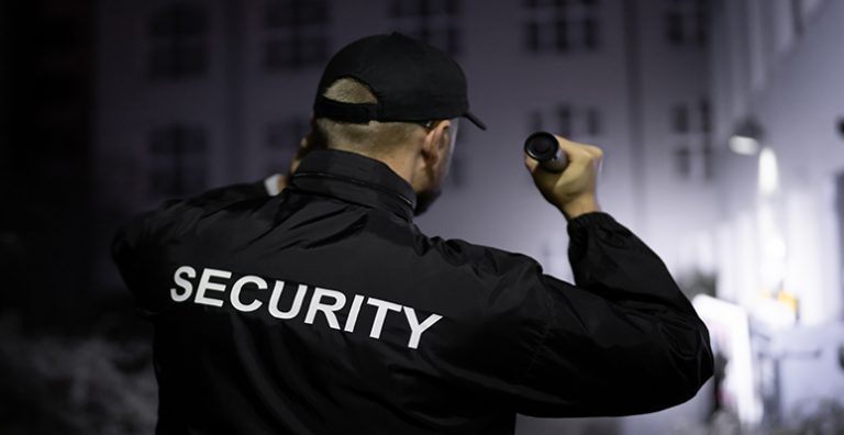 Security Guard Patrolling Business Property Shinning Flashlight St Louis