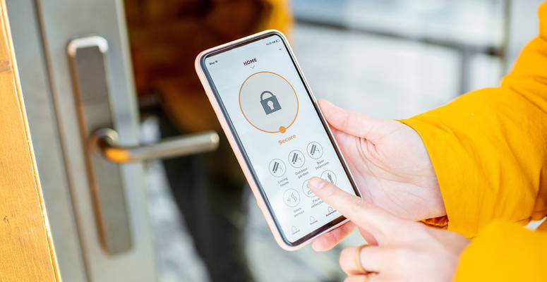 Woman Using Mobile Phone to Open Entry Door Equipped with Keyless Access Control Security System