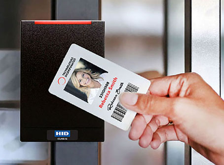 Employee Using Swipe Card Credential on Business Access Control Security System Card Reader