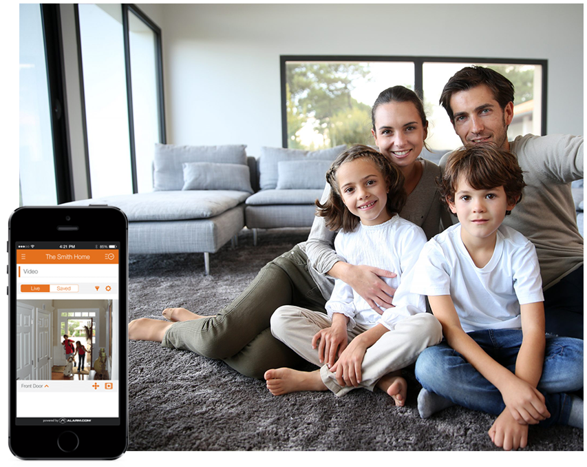 family in their home using cell phone security system