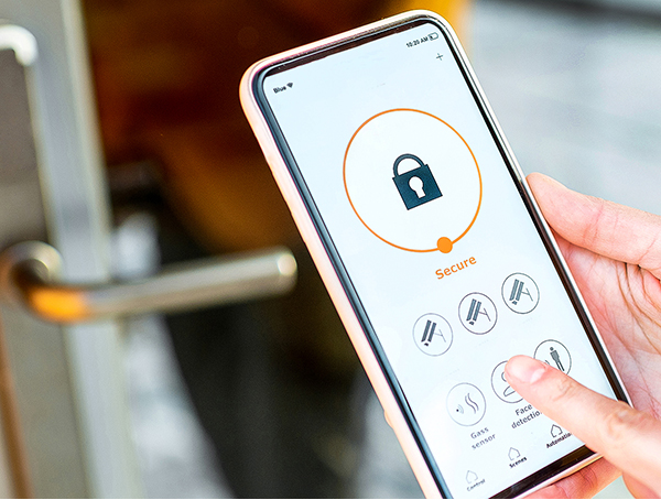 person using phone remotely to open keyless entry door to building with remote access control system