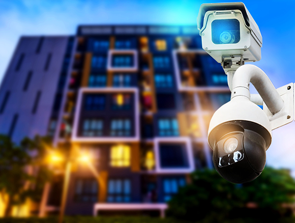 outdoor night vision security lights in front of multifamily apartment buildig