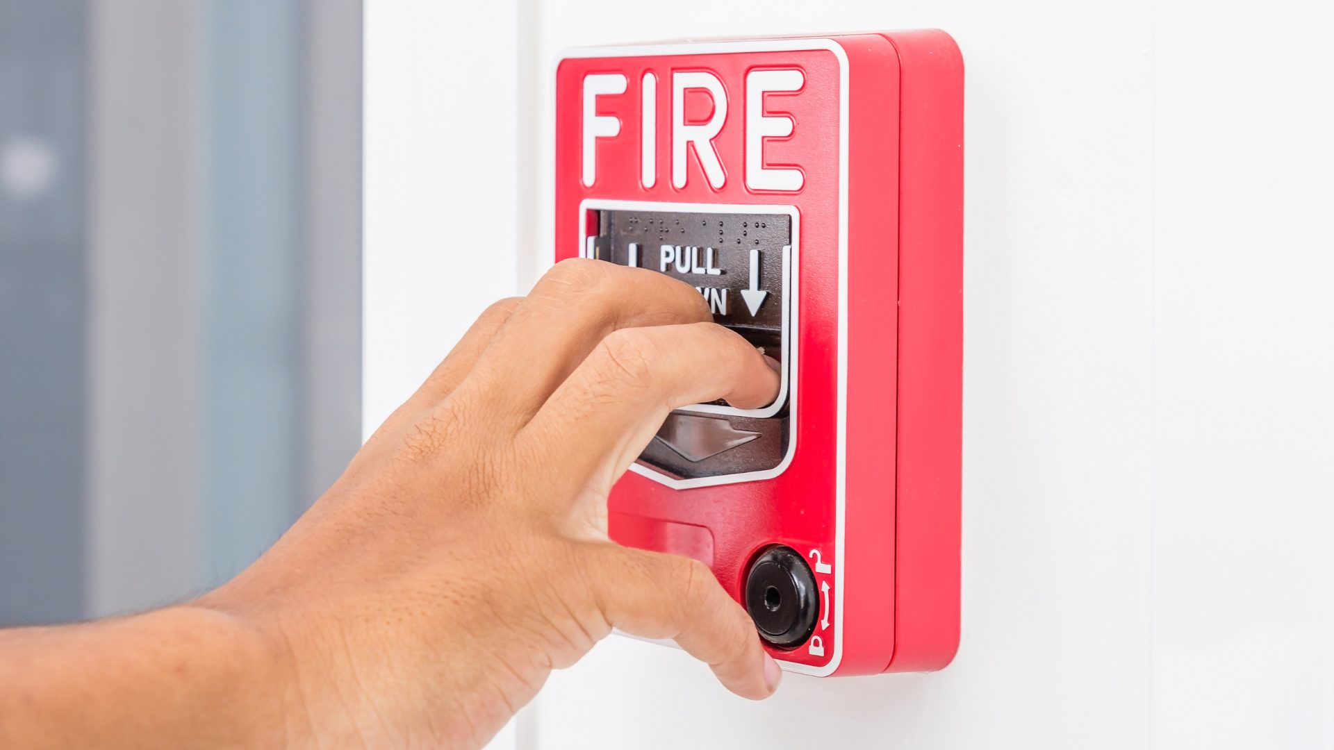 Hand testing fire alarm pull down